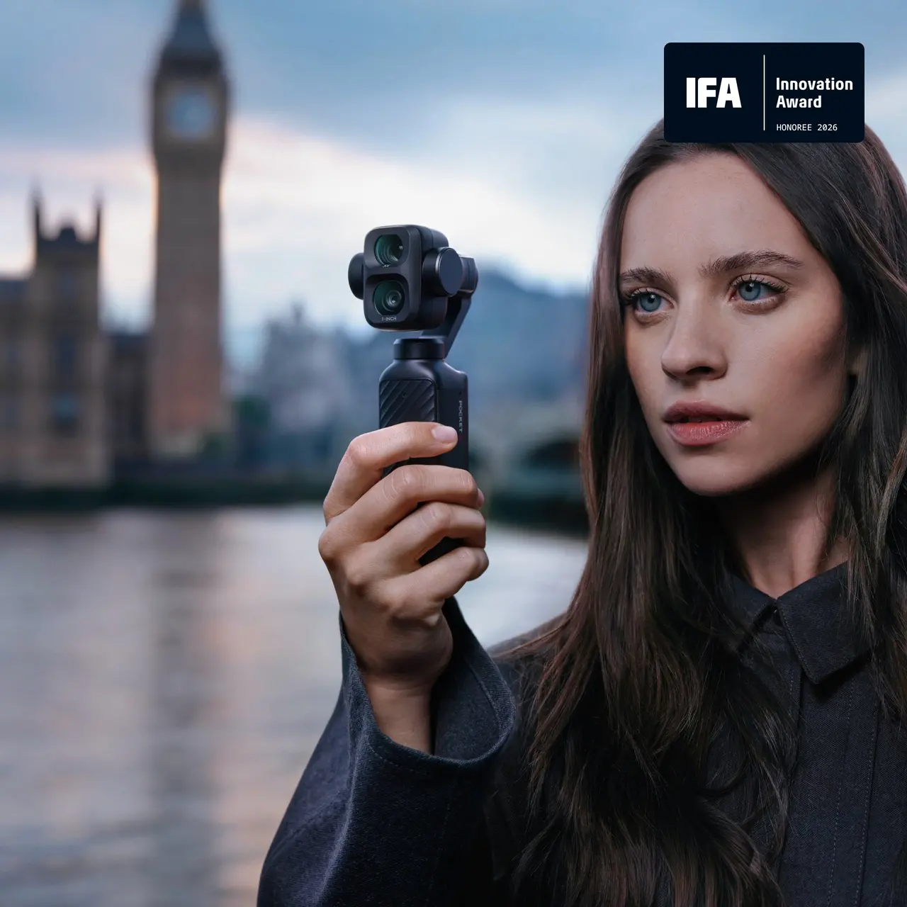 Traveller holding a DJI Osmo Pocket 4P while filming in London